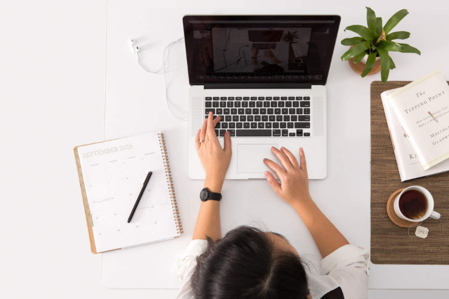 digital copywriter working on a MacBook