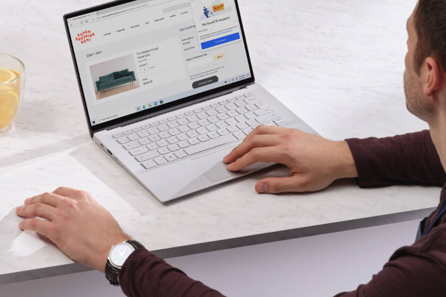a man browsing an eCommerce website on a laptop