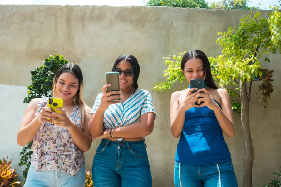 people using TikTok on their phones