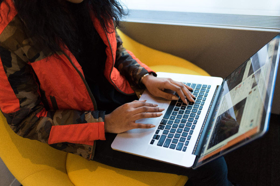 email marketer working on a laptop